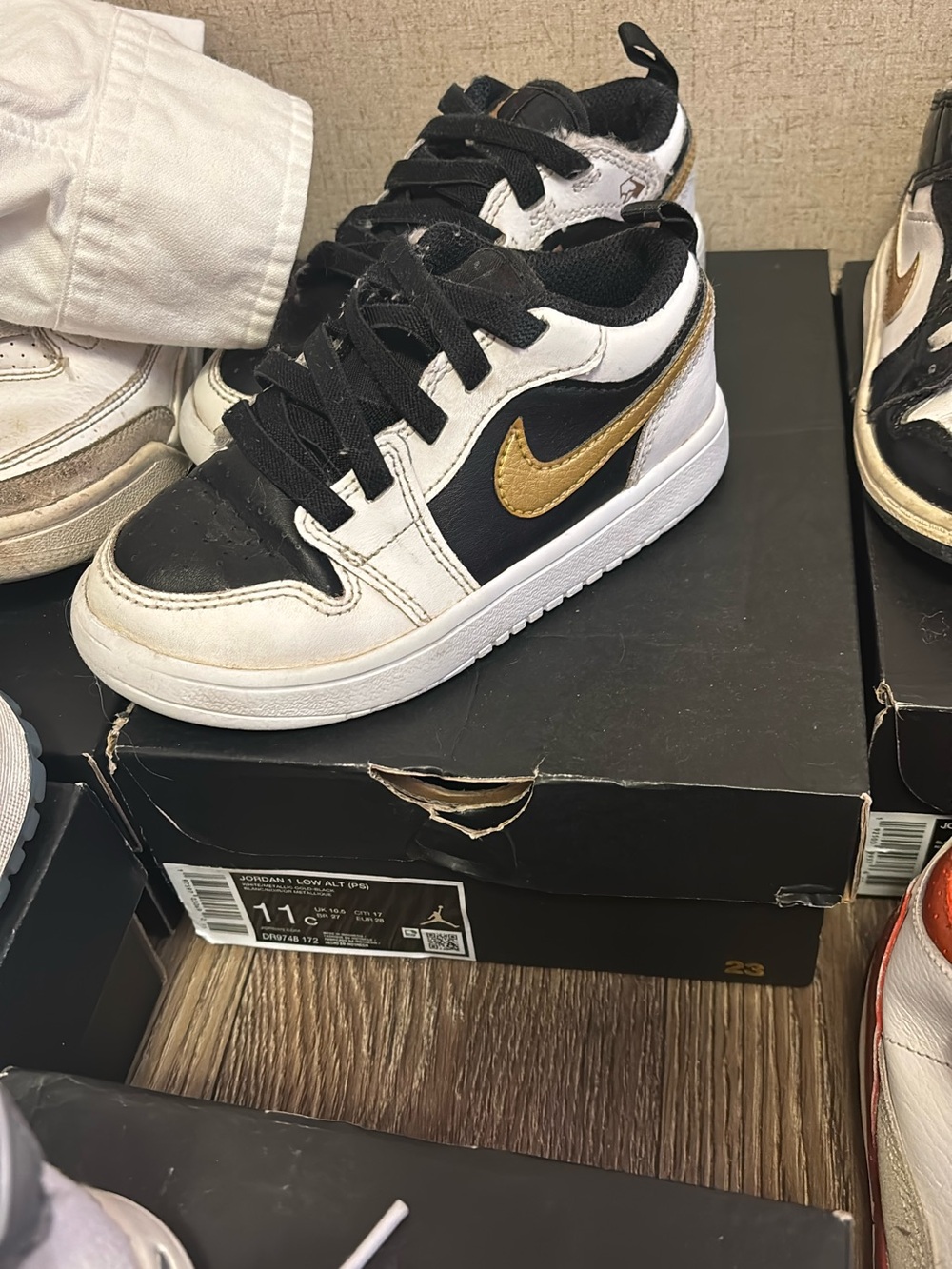 Nike Black White Gold Low-Top Sneakers with Metallic Swoosh